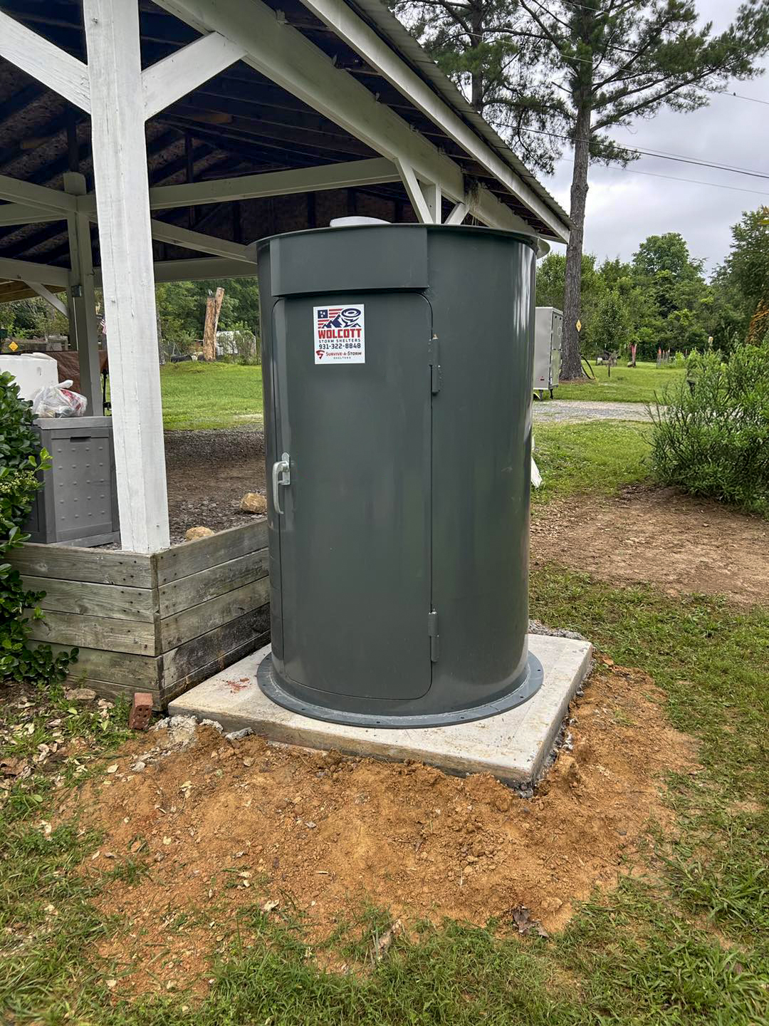 Cylindrical storm shelter by "Wolcott Outdoor Services LLC"